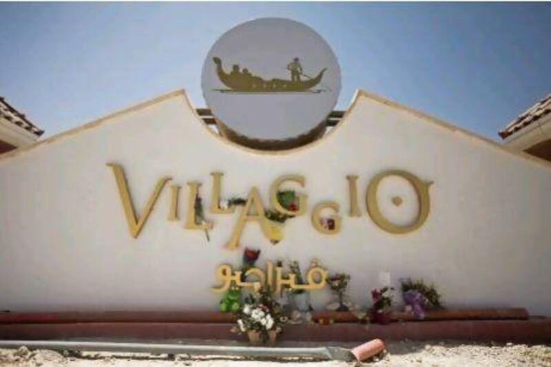 Flowers laid down at the entrance to the Villaggio Mall in Doha. The owner of the mall, the owner of the nursery and three senior mall officials were ordered to be detained as the investigation into the Doha mall fire continued.