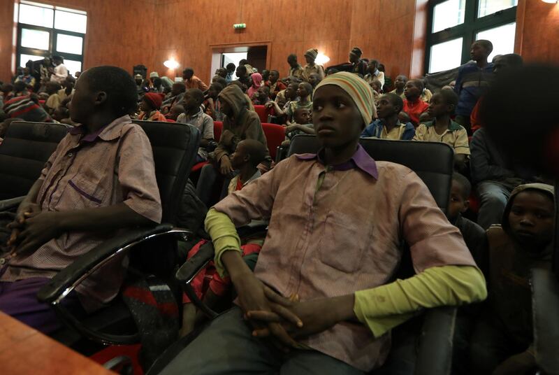 Rescued Nigerian school boys sit together at the Government house in Katsina, Nigeria. REUTERS