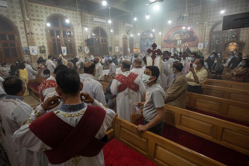 Coptic Christians pray during Easter Mass at Holy Cross Church in Cairo. AP Photo