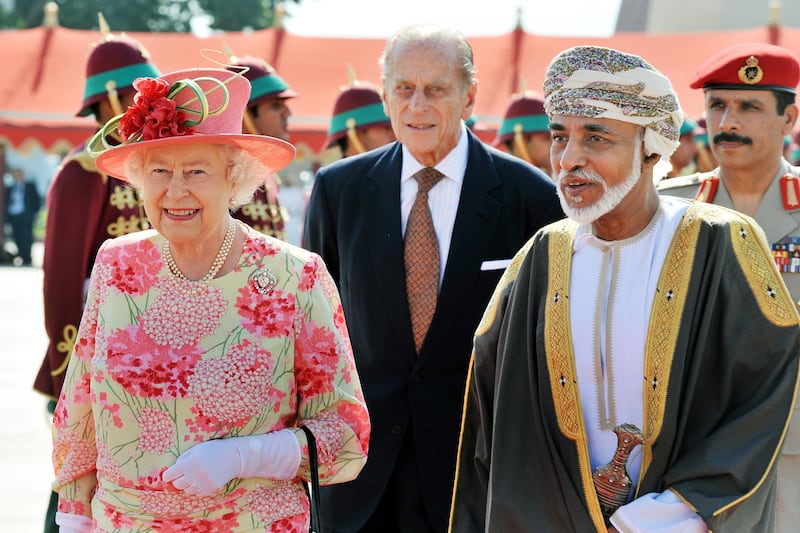 The queen walks towards her plane with Sultan Qaboos of Oman, before she and Prince Philip leave Muscat after a five-day state visit to the Gulf region. Getty