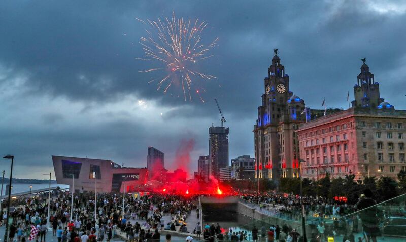 Fireworks go off outside the Liver Building in Liverpool. PA