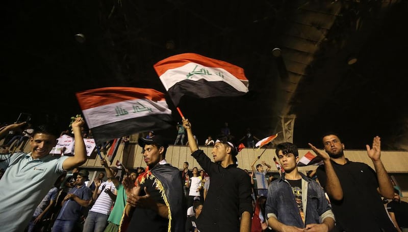 Supporters of Moqtada Al Sadr gather in the courtyard of celebrations after breaking into Baghdad's heavily fortified Green Zone on April 30. Ahmad AL Rubaye / AFP

