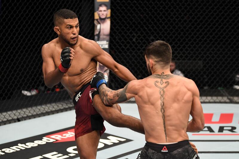 ABU DHABI, UNITED ARAB EMIRATES - OCTOBER 11: In this handout image provided by UFC,  (L-R) Youssef Zalal of Morocco kicks Ilia Topuria in their featherweight bout during the UFC Fight Night event inside Flash Forum on UFC Fight Island on October 11, 2020 in Abu Dhabi, United Arab Emirates. (Photo by Josh Hedges/Zuffa LLC via Getty Images)