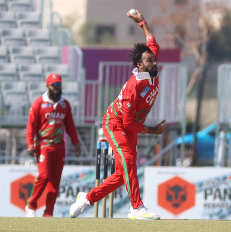 Bilal Khan of Oman bowls during the match with Nepal.