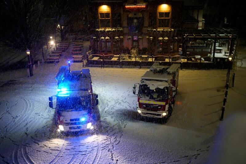 Greater Manchester Fire and Rescue Service emergency vehicles stand in the snow, as a preparations are made due to the risk of flooding in Didsbury. Getty Images
