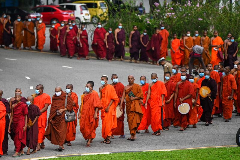 Buddhist monks arrive for a meeting at Independence Memorial Hall in Colombo to express their solidarity with those protesting against the government's contribution to Sri Lanka's crippling economic meltdown. AFP