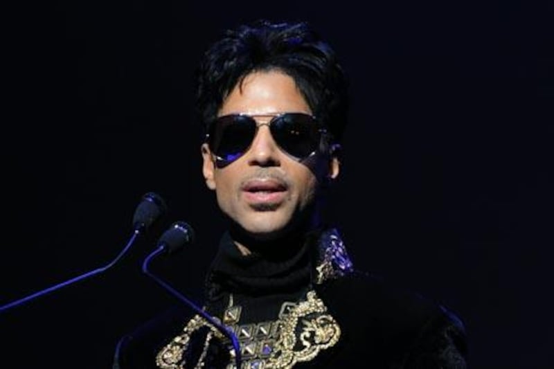 NEW YORK - OCTOBER 14: Singer/musician Prince makes an announcement at The Apollo Theater on October 14, 2010 in New York City.   Stephen Lovekin/Getty Images/AFP
