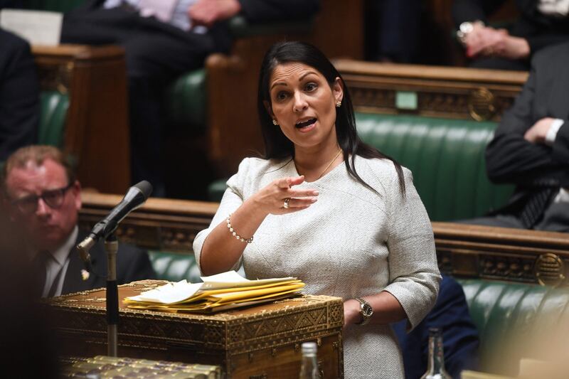 Britain's Home Secretary Priti Patel speaks on the plan to send migrants and asylum seekers who cross the Channel 'illegally' to Rwanda at the House of Commons in London. AFP / UK Parliament