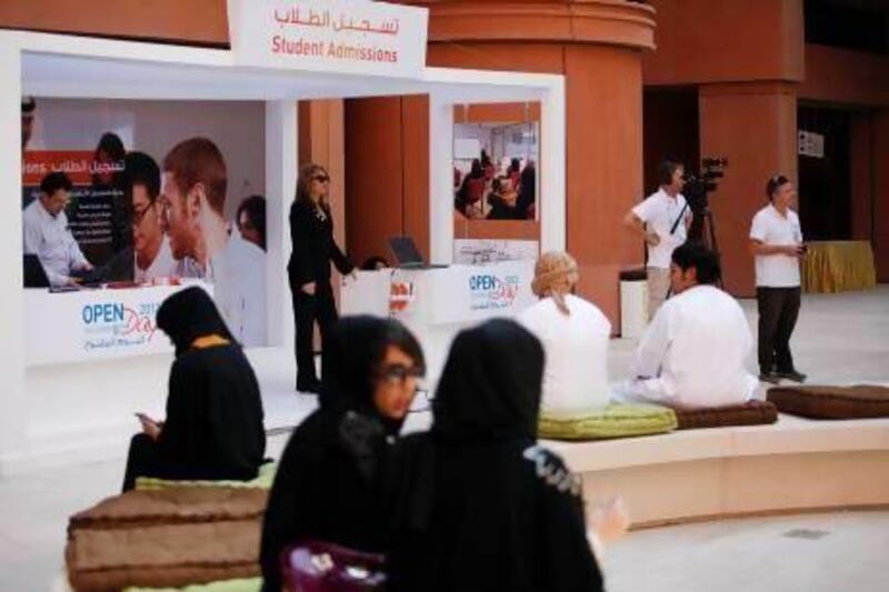 Potential students and their families visit Masdar Institute during an open day to learn more about the institute's offerings.