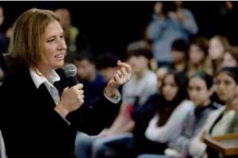 Israeli Foreign Minister Tzipi Livni and Kadima Party leader gestures as she speaks to high school students in Tel Aviv, Israel, Monday, Dec. 15, 2008. Livni leads the ruling Kadima party as Prime Minister Olmert prepares to step down and is seeking to lead the country in the upcoming February elections. (AP Photo/Ariel Schalit) *** Local Caption ***  JRL105_MIDEAST_ISRAEL_PALESTINIANS.jpg