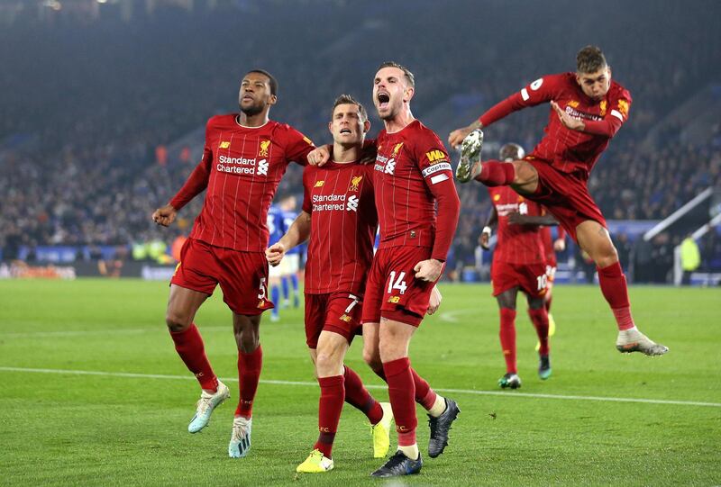 LEICESTER, ENGLAND - DECEMBER 26: James Milner of Liverpool celebrates after scoring his sides second goal with Jordan Henderson and Georginio Wijnaldum during the Premier League match between Leicester City and Liverpool FC at The King Power Stadium on December 26, 2019 in Leicester, United Kingdom. (Photo by Alex Pantling/Getty Images)