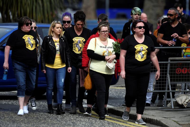 Mourners wearing Harry Potter themed shirts. Reuters