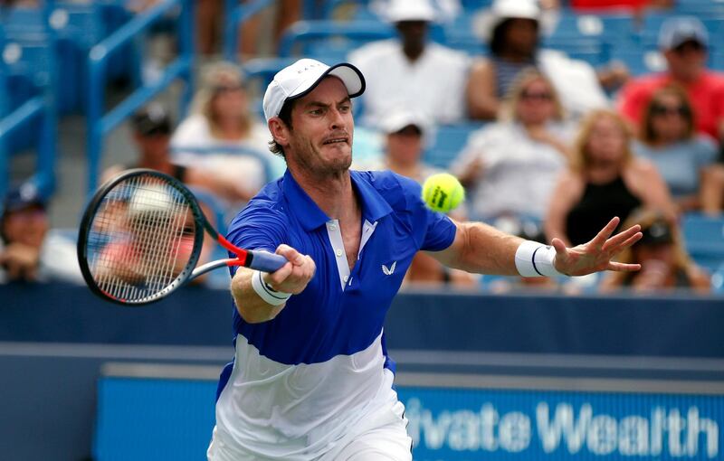 Andy Murray, of Britain, returns a shot against Richard Gasquet, of France, during first-round play at the Western & Southern Open tennis tournament Monday, Aug. 12, 2019, in Mason, Ohio. (AP Photo/Gary Landers)