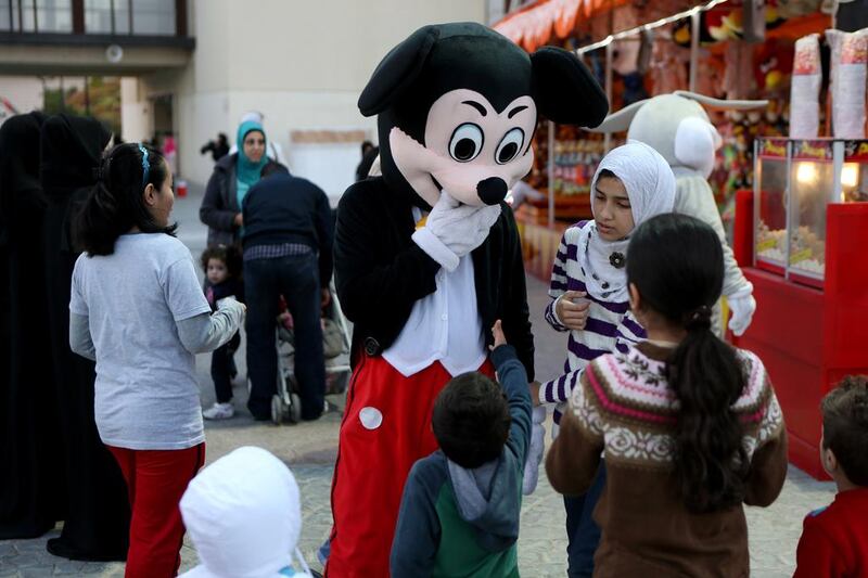 Mickey Mouse, Donald Duck, Garfield, Hello Kitty and other popular characters are on hand to greet visitors as they enter the park and to perform a dance with the children on stage. Sammy Dallal / The National