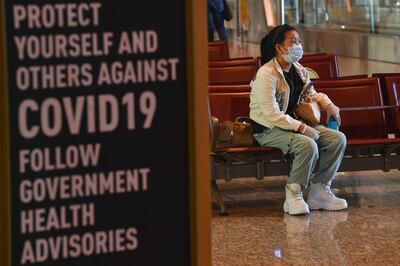 A passenger waits to board her flight at the Chhatrapati Shivaji Maharaj International Airport (CSMIA) after domestic flights resumed, in Mumbai on May 28, 2020.   Domestic air travel resumed in India on May 25 after a two-month shutdown over the coronavirus pandemic, a top minister said May 27, in a further easing of the lockdown. The government halted all domestic traffic on March 25 days after suspending international flights as it imposed a strict nationwide shut down to halt the spread of the coronavirus. 
 / AFP / INDRANIL MUKHERJEE
