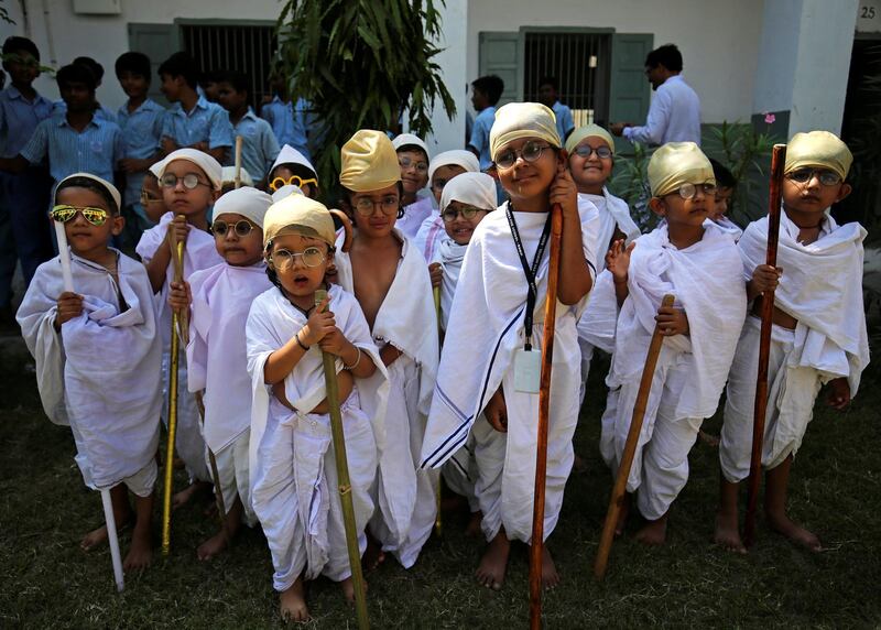 Students dressed as Mahatma Gandhi take part in an event to mark Gandhi's 150th birthday, at a school in Ahmedabad, India. Amit Dave/Reuters