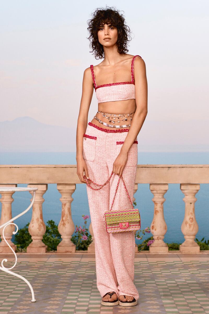 Peach boucle tweed is reinvented into a matching bandeau top and wide-cut trousers