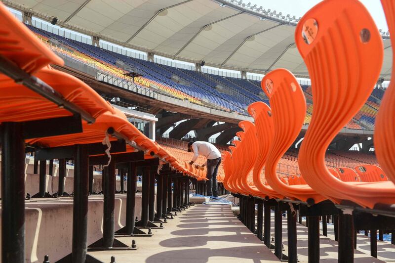 A worker cleans the Narendra Modi Stadium in Ahmedabad. AFP