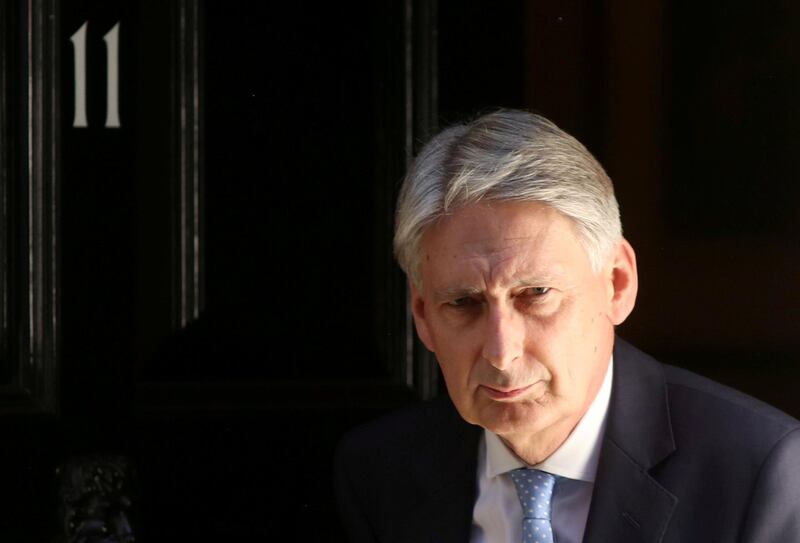 FILE PHOTO: Britain's Chancellor of the Exchequer Philip Hammond leaves 11 Downing Street in London, Britain, July 2, 2018. REUTERS/Simon Dawson/File Photo