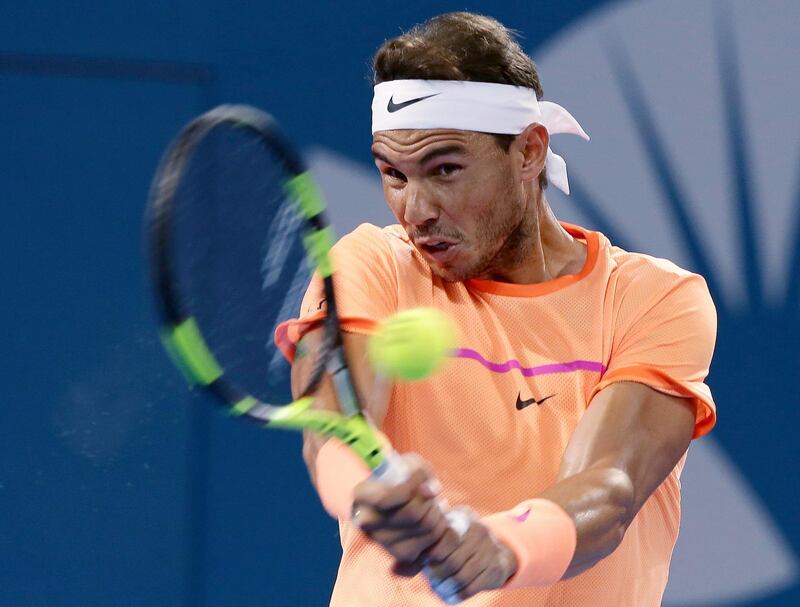 FILE - In this Jan. 6, 2017, file photo Rafael Nadal of Spain plays a shot in his quarterfinal match against Milos Raonic of Canada at the Brisbane International tennis tournament in Brisbane, Australia. Nadal has withdrawn from the 2018 Brisbane International due to his "late start of preparation" for the new season. (AP Photo/Tertius Pickard, File)