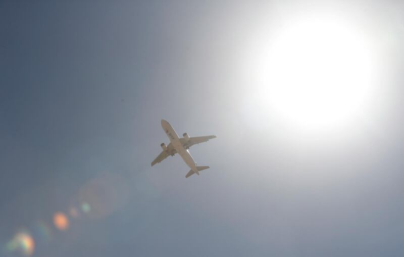 A cargo plane of the World Food Programme (WFP), carrying humanitarian aid prepares to land over Sanaa, November 30. EPA