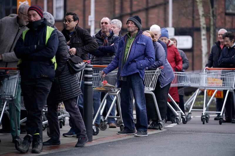 Senior citizens queue to shop at Sainsbury's Supermarke in Northwich. Getty Images
