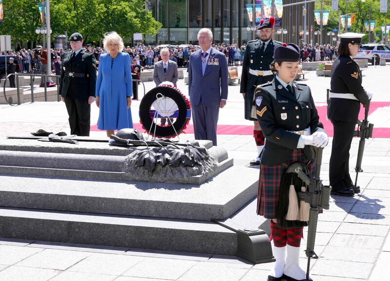 Britain's Prince Charles and Camilla, Duchess of Cornwall, lay a wreath at the National War Memorial in Ottawa on May 18, 2022. AFP