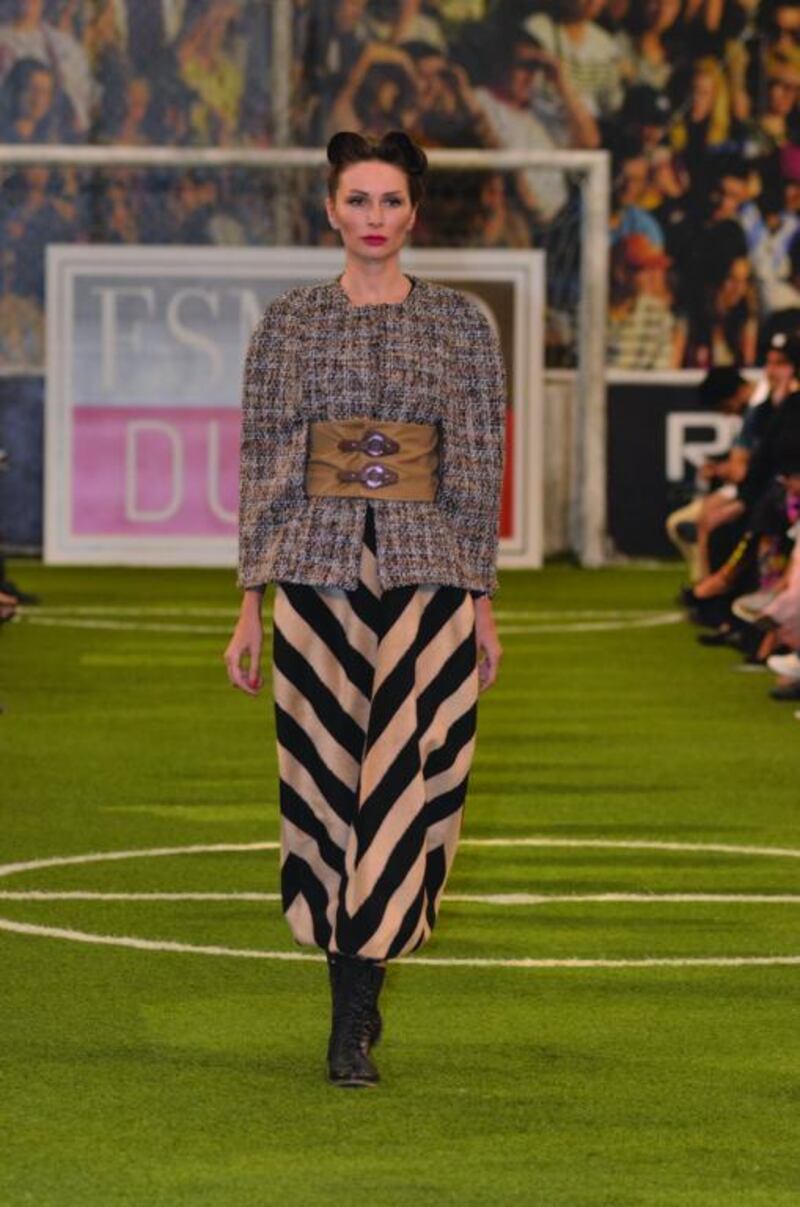 Bushra Ashfaq displays a strong grasp of proportion with this chic tweed cape, with rounded shoulder and cinched waist, over a graphic bubble-cut skirt. Courtesy ESMOD