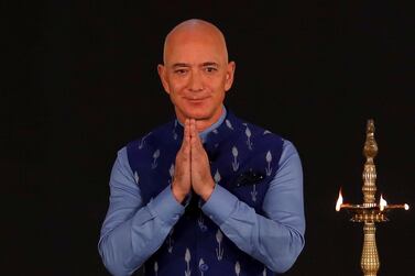 Jeff Bezos, founder of Amazon, greeting audience with folded hands while attending an event in New Delhi on Wednesday. Reuters
