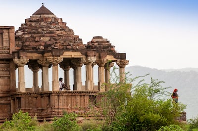 Locals take a break amid the ruins of a temple in the ghost town of Bhangarh. Gustasp Irani and Jeroo Irani for The National