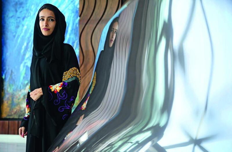 Hyam Al Meraikhi, who is a graphic designer and artist, uses her work to spread positivity. Lee Hoagland / The National