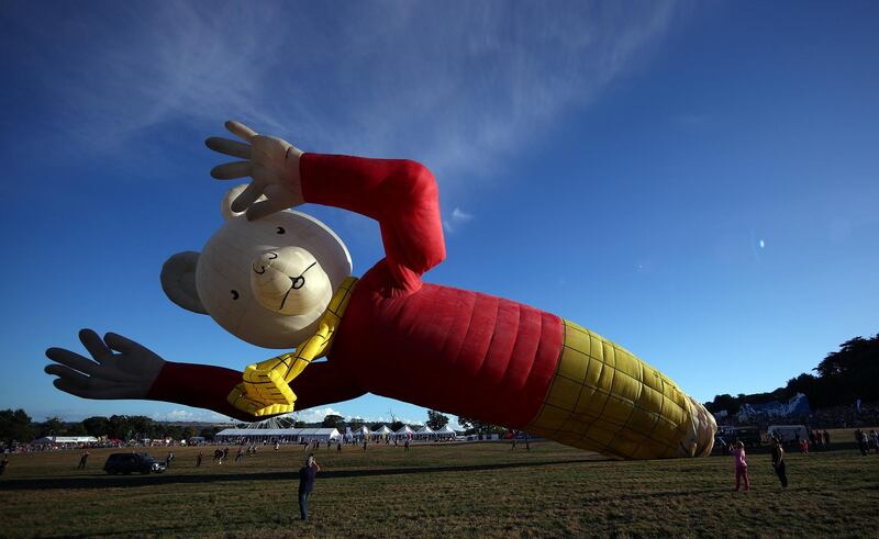 A hot air balloon in the shape of children's book character Rupert Bear is seen tethered before the launch of the Bristol International Balloon Fiesta in south west England. Reuters