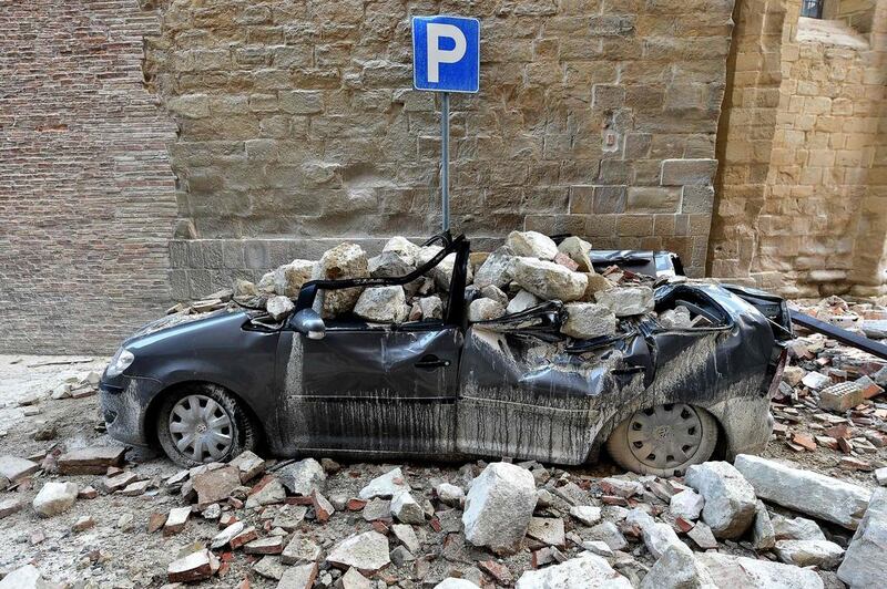 A damaged car sits in the “red zone” of Camerina, Italy, on October 28, 2016, where 80 per cent of the houses have been left uninhabitable after two powerful earthquakes hit the region a few days earlier. Thousands were forced to flee but “miraculously” no one was killed. Italy’s national geophysics institute has recorded almost 700 tremors, with experts saying they could go on for weeks or months. Alberto Pizzoli / Agence France-Presse