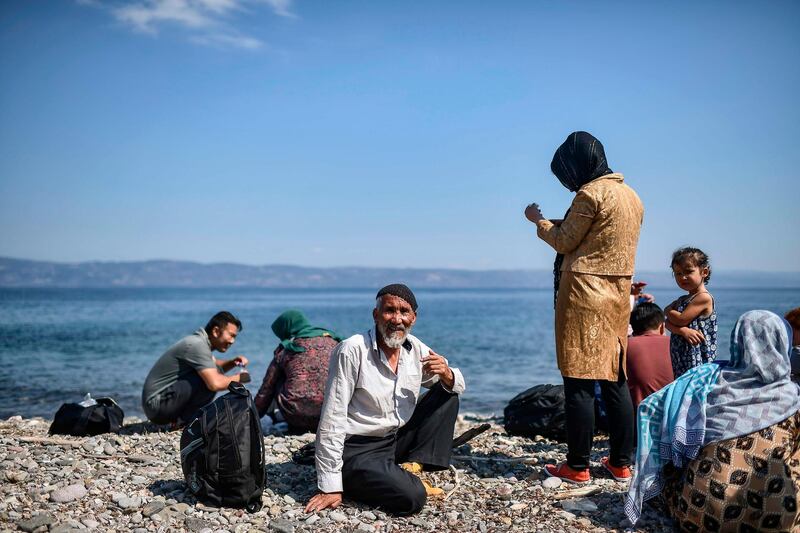 TOPSHOT - Migrants from Afghanistan arrive after crossing the Aegean Sea from Turkey with a dinghy on the Greek Mediterranean island of Lesbos on August 6, 2018.
More than 1,500 refugees and migrants have died trying to cross the Mediterranean Sea to Europe in the first seven months of this year, over half of them in June and July, the UN refugee agency said on August 3, 2018. / AFP PHOTO / Aris MESSINIS