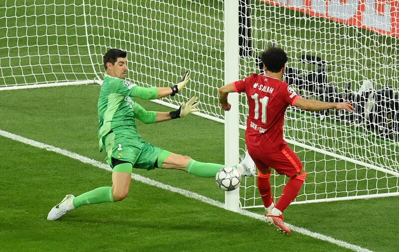 Real Madrid goalkeeper Thibaut Courtois saves from Liverpool attacker Mohamed Salah in the second half. Getty