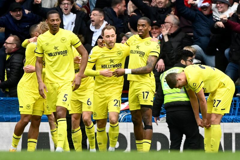 Eriksen celebrates with teammates. EPA