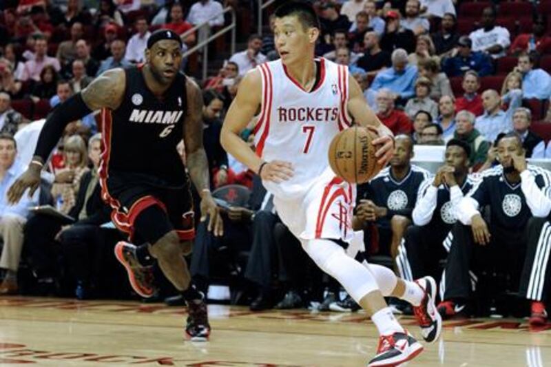 Houston Rockets' Jeremy Lin tries to drive past Miami Heat's LeBron James