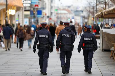 Police officers walk down a shopping street after the Austrian government announced a lockdown including the closure of all non-essential shops, as the spread of the coronavirus disease (COVID-19) continues, in Vienna, Austria, November 16, 2020. REUTERS/Leonhard Foeger