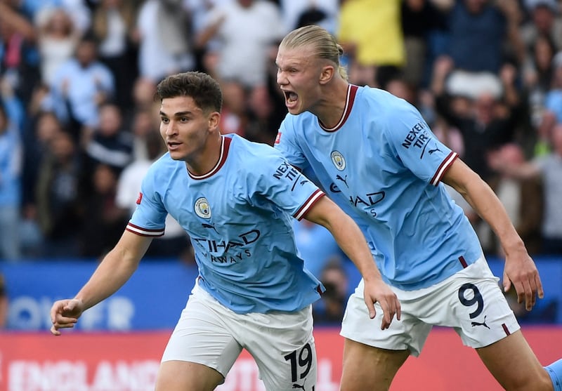 Manchester City's Julian Alvarez celebrates scoring their first goal with Erling Haaland. Reuters