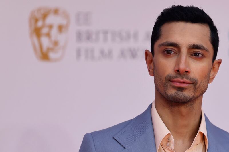 Ahmed poses on the red carpet upon arrival at the Bafta Awards at Royal Albert Hall in London, England. AFP