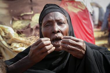 Dhahabo Isse, 60, describes how she fled from the drought without food or water causing four of her children to die of hunger, outside her makeshift tent at a camp for the displaced on the outskirts of Mogadishu, Somalia Thursday, June 30, 2022.  The war in Ukraine has abruptly drawn millions of dollars away from longer-running humanitarian crises and Somalia is perhaps the most vulnerable as thousands die of hunger amid the driest drought in decades.  (AP Photo / Farah Abdi Warsameh)