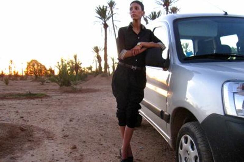Marrakech entrepreneuse Raja Bikhtancer, 26, beside the 2010 Peugeot Partner in which she travels the city overseeing two companies she founded: estate agency Karrefour Imo Consulting and ice cube producer AJARPRO. Photo by John Thorne for The National