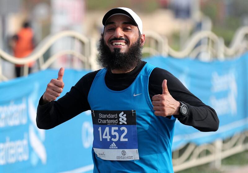 Dubai, United Arab Emirates - January 25, 2019: People run in the Standard Chartered Dubai Marathon 2019. Friday, January 25th, 2019 at Jumeirah, Dubai. Chris Whiteoak/The National