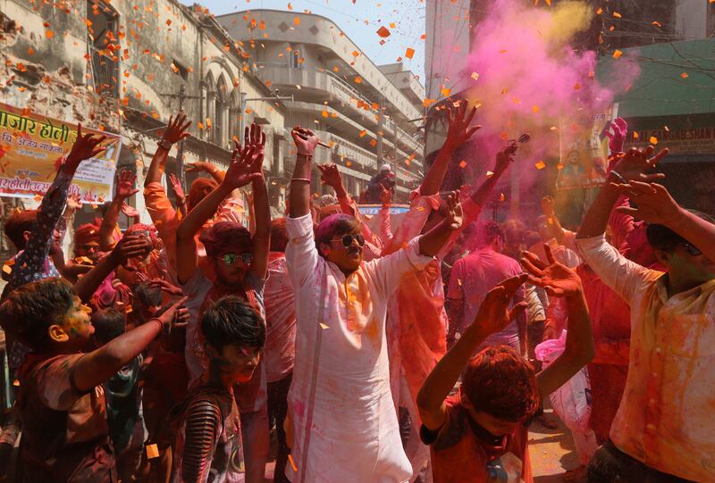 People celebrate Holi, the Hindu festival of colours, in Hyderabad, India. AP