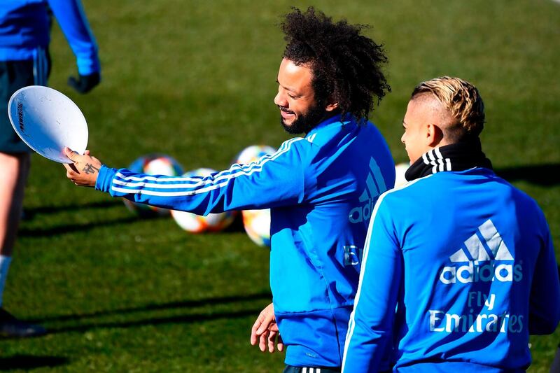 Real Madrid's Brazilian defender Marcelo, left, shares a joke with Dominican forward Mariano. AFP