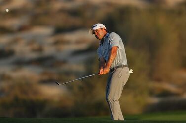Richard Sterne of South Africa chips on to the eighth green during the first round of the Omega Dubai Desert Classic at Emirates Golf Club in Dubai. Getty