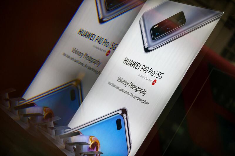 An advertisement for a Huawei P40 Pro 5G mobile phone inside an EE store in London, U.K., on Tuesday, Nov. 24, 2020. The U.K. is considering a ban on the installation of Huawei Technologies Co. 5G equipment as soon as next year to appease hawks pushing for tighter restrictions on the Chinese network equipment maker, according to people familiar with the matter. Photographer: Hollie Adams/Bloomberg