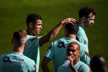 Portugal's national football team forward Cristiano Ronaldo (2nd L) and team mates attend a training session at the Cidade do Futebol training camp in Oeiras, outside Lisbon, on August 31, 2021, ahead of their FIFA World Cup Qatar 2022 European qualifying round group A football match against Ireland.  (Photo by PATRICIA DE MELO MOREIRA  /  AFP)