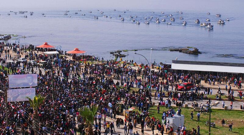 Supporters of Syrian President Bashar al-Assad attend a rally to support him and the army, at the coastal city of Jableh in Lattakia, March 6,2014, in this handout photograph distributed by Syria's national news agency SANA. REUTERS/SANA/Handout via Reuters (SYRIA - Tags: POLITICS CIVIL UNREST) ATTENTION EDITORS - THIS IMAGE HAS BEEN SUPPLIED BY A THIRD PARTY. IT IS DISTRIBUTED, EXACTLY AS RECEIVED BY REUTERS, AS A SERVICE TO CLIENTS. FOR EDITORIAL USE ONLY. NOT FOR SALE FOR MARKETING OR ADVERTISING CAMPAIGNS