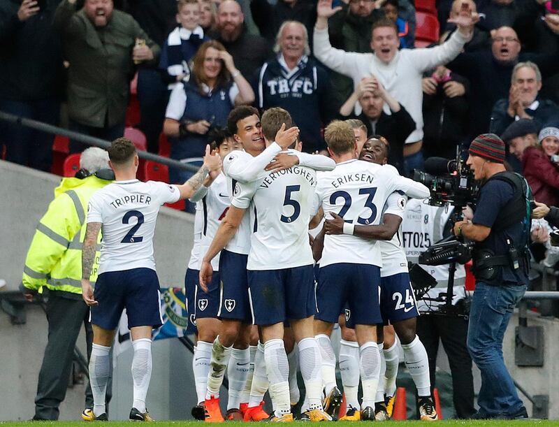 Tottenham's teammates celebrate after scoring their side's fourth goal during the English Premier League soccer match between Tottenham Hotspur and Liverpool at Wembley Stadium in London, Sunday, Oct. 22, 2017. (AP Photo/Frank Augstein)